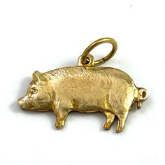 VINTAGE BRASS PIGGY CHARM ITEM DESCRIPTION This listing is for a vintage brass charm of a sweet little pig. Small in size but has nice detail. I love his little face and curly tail! Wear as a bracelet charm or as a dainty necklace pendant. Never used. Vintage old stock. Any minor flaws or patina from age / storage. Some patina on the back of the charms. Brass Jewelry Care: brass will develop a patina when worn/with age. Exposure to water, high humidity or lotions will quicken the process. If you do not like this patina, brass can be polished back to its original luster with a brass polishing cloth! Quarter and ruler in photo for size reference. Please check out my Etsy jewelry shop! Tiny Pigs, Pig Pet, Morristown Nj, Pet Pigs, Brass Charms, Bracelet Charm, Jewelry For Her, Pet Gift, Brass Jewelry