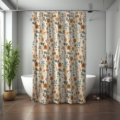 a bathroom with a bathtub, toilet and shower curtain that has flowers on it