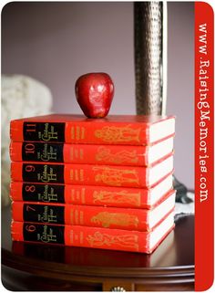 a stack of books with an apple on top