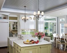 a large kitchen with an island in the middle