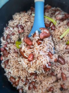 rice and beans are mixed together in a skillet