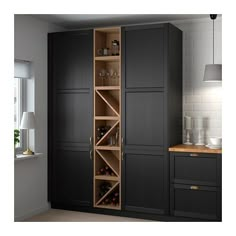 a tall black cabinet with wine bottles in it