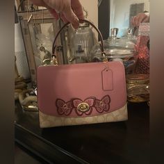 Coach Top Handle Has Adjustable Strap That’s Removable Good Condition Item Is Used Check Pictures Closely Coach Multicolor Top Handle Shoulder Bag, Pink Top Handle Coach Shoulder Bag, Pink Coach Satchel With Handles, Pink Coach Bags With Leather Handles, Pink Coach Bag With Gold-tone Hardware, Bags Coach, Colorful Butterflies, Handle Bag, Coach Bags