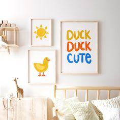 three framed pictures hang on the wall above a bed in a child's room