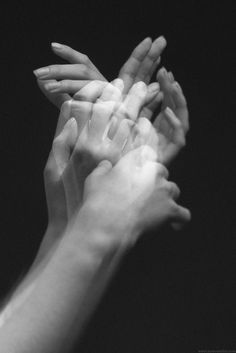 two hands reaching up towards each other with the words awesome god above them in black and white