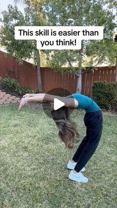 a woman doing a handstand in the yard