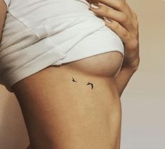 a woman's stomach with two birds on it and the bottom half of her body