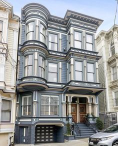 an old victorian style house in san francisco, california with many windows and balconies