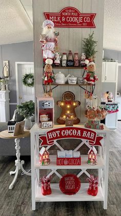 an assortment of christmas items on display in a store with signs above them that read, hot cocoa bar not cocoa