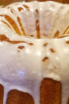 a bundt cake with white icing on a green plate