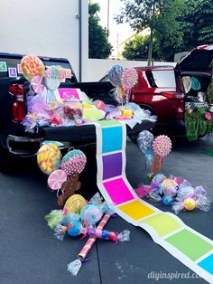 there are many balloons and other decorations on the back of a pick - up truck