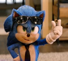 sonic the hedgehog is wearing sunglasses and holding a finger up in front of him