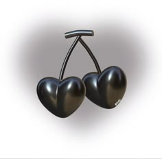 two black heart shaped cherries hanging from a hook on a white background with the word love written below them