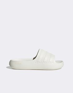 Shoes by adidas Originals Sliding into your cart Slip-on style Branded strap Open toe Molded footbed Chunky sole Comfortable White Slip-on Slides, Sporty Slides With Textured Sole For Streetwear, White Synthetic Slide Slippers, Comfortable White Slide Slippers, Comfortable White Slides, Sporty Slides With Textured Sole For Spring, Sporty Slip-on Slides For Spring, White Slip-on Synthetic Slippers, White Casual Slippers With Removable Insole