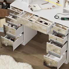 a white desk with drawers on top of it