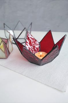 two paper boats sitting on top of a table