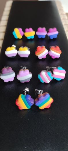 Add a pop of color and sparkle to your outfit with these handmade rainbow colored polymer clay pride earrings! These vibrant earrings are crafted with love and skill, featuring twisted designs that catch the light beautifully. Perfect for expressing your unique style and spreading joy wherever you go. Make a statement with these eye-catching pieces that are sure to brighten up your day. Pride Clay Ideas, Bisexual Outfits, Pride Earrings, Lgbtq Quotes, Gay Sticker, Lgbtq Funny, Asexual Pride, Non Binary, Rainbow Earrings