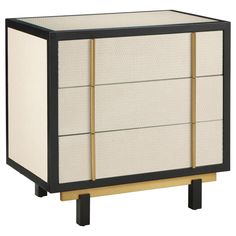 a black and white cabinet with gold accents