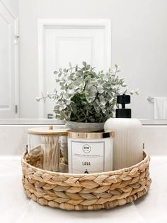 a basket filled with personal care items on top of a bathroom counter next to a mirror