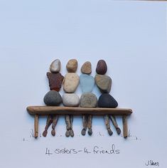 a group of rocks sitting on top of a wooden bench