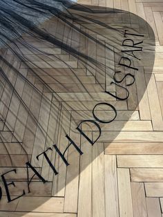 a wooden floor with the word detour etched on it's side in black ink