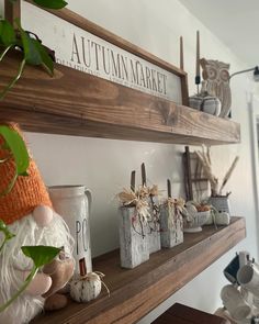 the shelves are decorated with pumpkins and other decorative items