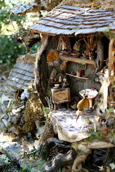 a doll house made out of wood and other items