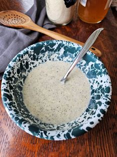 a bowl of oatmeal sits on a wooden table