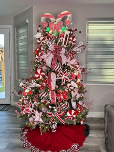 a christmas tree decorated with candy canes and candies