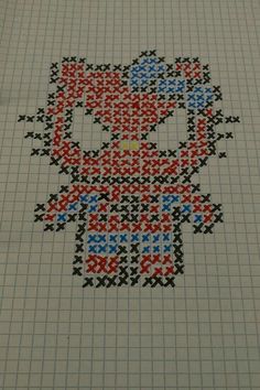 an image of a hello kitty cross stitched on to a sheet of graph paper