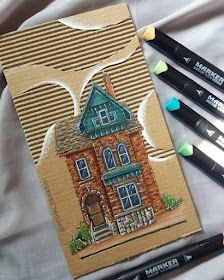 some markers are next to a drawing of a house