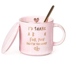 a pink coffee mug with a spoon in it that says i'd shank abh for you