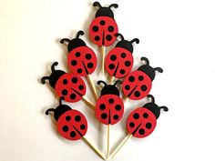 a bunch of ladybugs are sitting on top of a toothpick holder