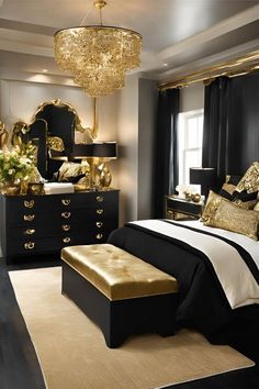 a bedroom decorated in black and gold with a chandelier hanging from the ceiling