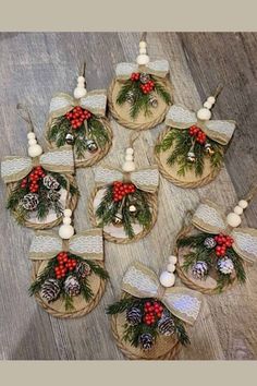 christmas decorations are arranged in baskets on the floor with pine cones and red berry berries