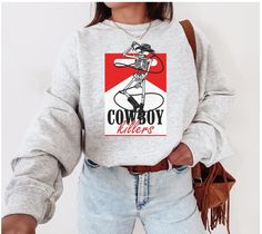 Trendy Cowboy Killer Sweatshirt is a super cozy pullover, perfect for the Wild West Aesthetic. Perfect pullover for any Country Music Concert or to throw on at a rodeo! Yee Haw Sizes are Unisex adult  50% cotton, 50% Polyester Machine wash inside out with like colors. Tumble dry on low to medium heat. Do not iron directly on image. Please refer to size chart for reference before purchasing. If you want an oversized fit, go up 1-2 sizes. Please feel free to message with any questions. Please note Country Girl Aesthetic, Cowboy Killer, Aesthetic Crewneck, Sweatshirt Western, Western Sweatshirts, Country Sweatshirts, Wearing Color, Cozy Pullover, Country Outfits