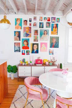 an instagram photo with pink chairs and pictures on the wall above it, along with a white dining room table