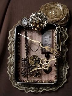 an altered photo with jewelry and flowers on a lace doily in the shape of a frame