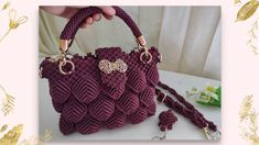 a crocheted handbag is being held by a woman's hand with gold hardware