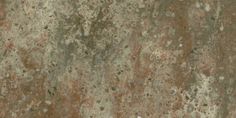 an old, dirty concrete surface with some rust on it