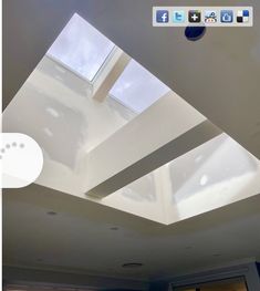 an image of a ceiling with skylights in the middle and windows on the other side