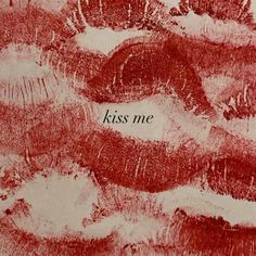 a red and white drawing with the words kiss me on it