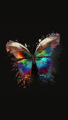 a colorful butterfly flying through the air with sprinkles on it's wings