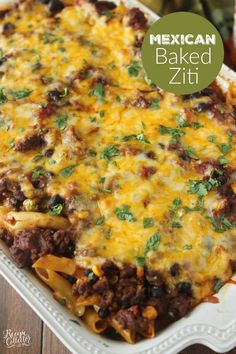 mexican baked ziti in a white casserole dish on a wooden table with text overlay