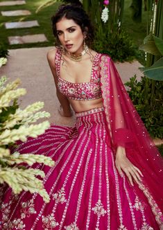 Pink raw silk blouse with zardosi, sequence and resham embroidered scallop edged square neckline and skirt paired with embroidered tulle dupatta. Embroidery Weaving, Sequence Lehenga, Raw Silk Blouse, Raw Silk Lehenga, Resham Embroidery, Rani Pink, Vacuum Storage, Lehenga Skirt, Pink Lehenga