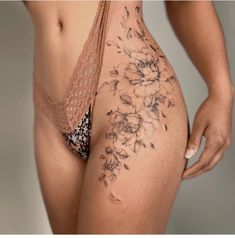 a close up of a person with flowers on their butts and the bottom half of her body