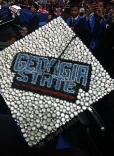 a graduation cap that has been made to look like some sort of something with the words georgia state on it