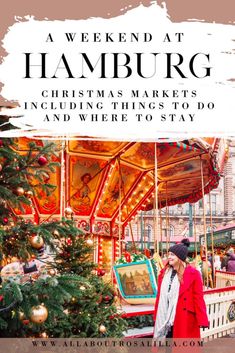 a woman standing in front of a merry - go - round carousel with christmas decorations