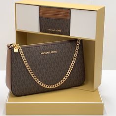 Please Look At Approximate Dimension Below Before Purchasing. 9.5"W X 5.5"H X 2.5"D Adjustable Strap: 20.5"-24.5" 100% Authentic Comes With Box. New Style - Michael Kors Giftable Boxed Items Xbody + Card Holder Comes With Box Brown Signature Color Coated Canvas--Pvc Material Gold Tone Hardware Interior Details: Back Slip Pocket, 3 Front Card Slots Lining: 100% Polyester Zip Fastening Imported 9.5"W X 5.5"H X 2.5"D Adjustable Strap: 20.5"-24.5 Brand Purses, Sac Michael Kors, Card Box Holder, Michael Kors Crossbody Bag, Fancy Bags, Michael Kors Crossbody, Black Leather Crossbody Bag, Chain Crossbody Bag, Purses Michael Kors