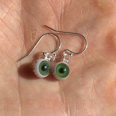 Treat yourself to something fun and spooky today! These eyes are so tiny you have to see them in person to believe the miniscule details. I think it would also be a great gift for any gothic friends you have :) Different materials are available for the ear wire (the hook that goes through the ear), select yours from the drop down menu. Pictured hooks are sterling silver. Green Novelty Earrings For Halloween, Handmade Green Halloween Earrings, Green Novelty Jewelry For Halloween, Green Earrings For Halloween Gift, Quirky Handmade Halloween Jewelry, Eyeball Jewelry, Eyeball Earrings, Realistic Eye, Eye Earrings